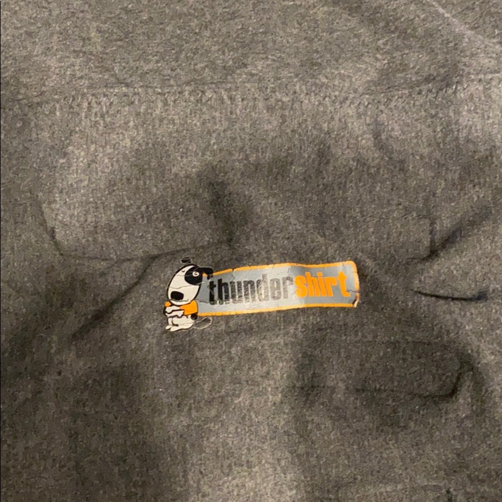 Thunder shirt. Used to reduce dog anxiety.